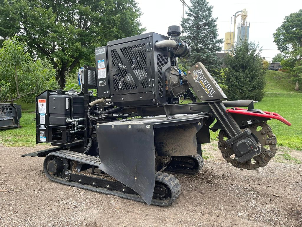 Tracked stump grinder parked on a job site